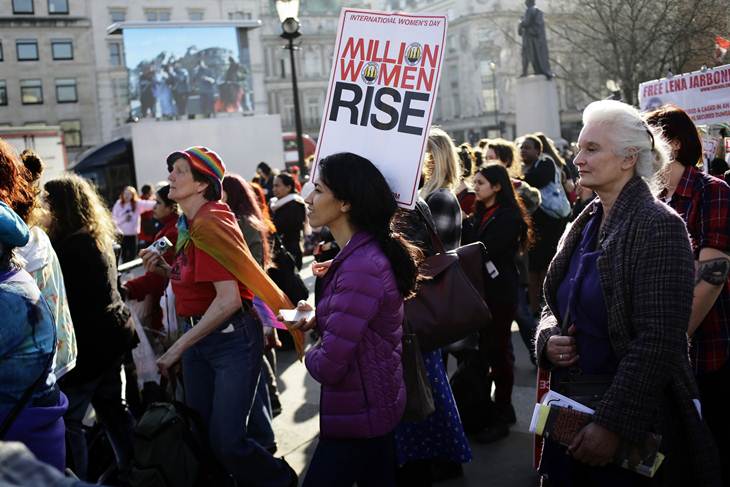 Women listen to speakers at the Million Women Rise rally in Trafalgar Square in London